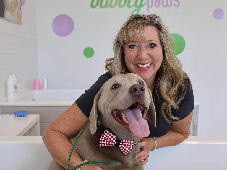 woman and dog smiling